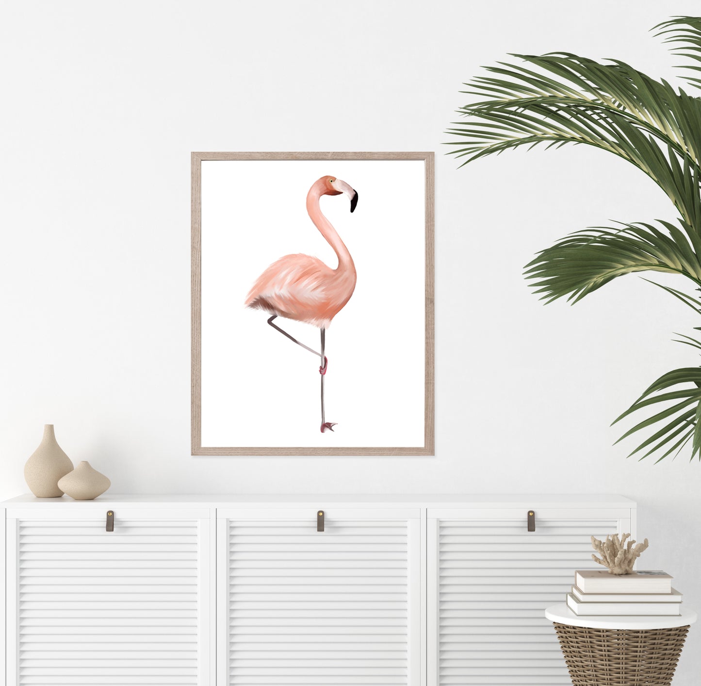 Painting of a pink flamingo on a white background with a wood frame hanging on a wall - Studio Q - Art by Nicky Quartermaine Scott