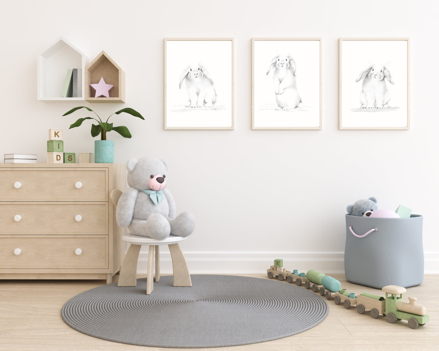 Set of 3 white bunny sketches in grey on a plain white background. Prints are mounted in wood frames and hung on a wall of a child's bedroom - Studio Q - Art by Nicky Quartermaine Scott