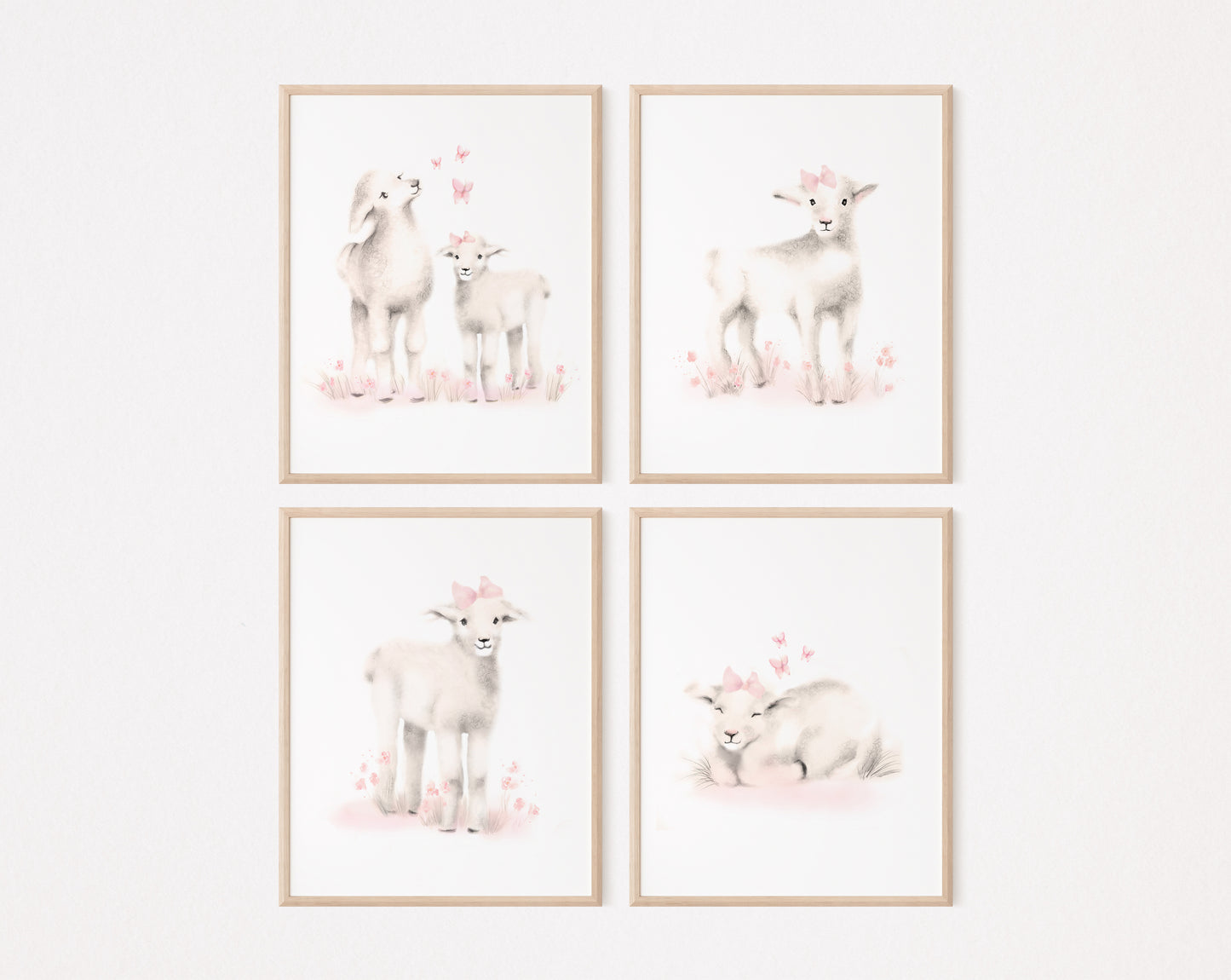 Set of 4 lamb prints from drawings in tones of sepia beige and blush pink. Lambs have pink flowers, bows and butterflies around them. The prints are on a white background and are framed in light wood frames.  The set hangs against a plain light pink background - Studio Q - Art by Nicky Quartermaine Scott