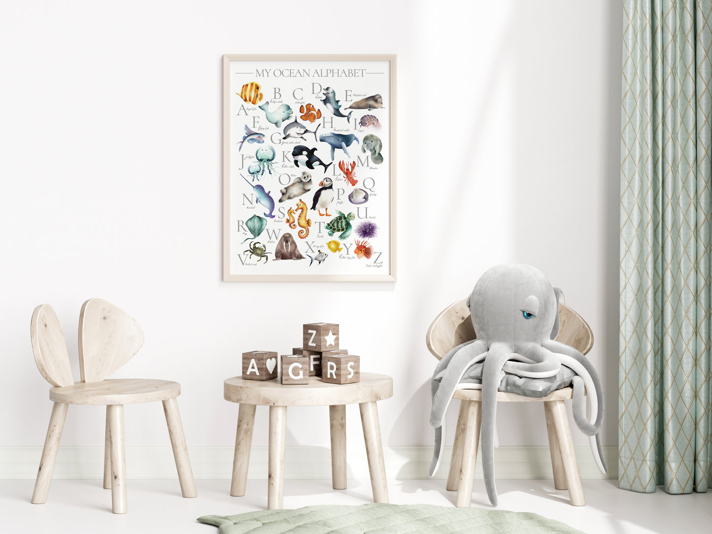 Colorful ocean animal alphabet print for kids with underwater animals from A thru Z framed in a light wood frame hanging on a wall in a kids bedroom- Studio Q - Art by Nicky Quartermaine Scott