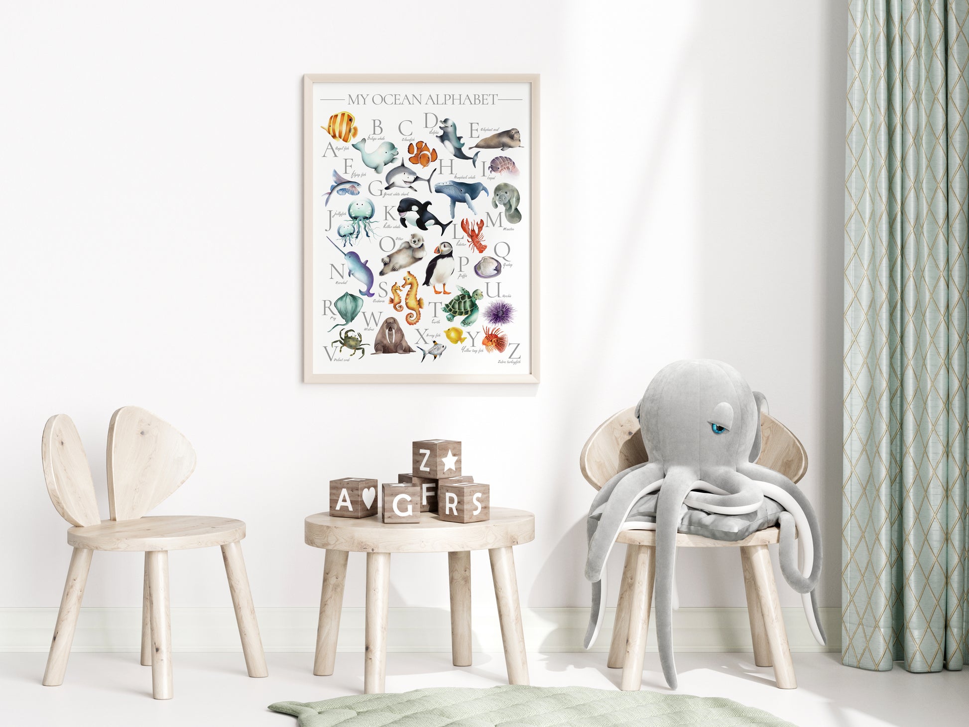 Colorful ocean animal alphabet print for kids with underwater animals from A thru Z framed in a light wood frame hanging on a wall in a kids bedroom- Studio Q - Art by Nicky Quartermaine Scott